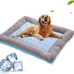 A golden retriever dog lies on a square cooling pet bed with a light blue quilted center and a gray striped border, shown on a white background with ice cubes and small green leaf graphics.